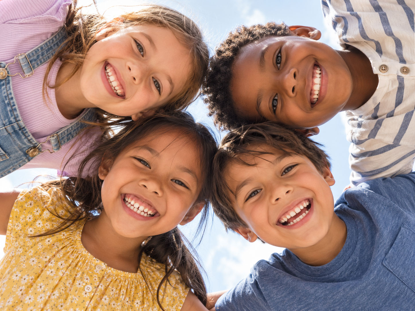 Smiling children gathered together